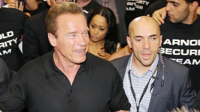 Harry Korras (right) flanks Arnold Schwarzenegger at the 2015 Arnold Classic in Melbourne.