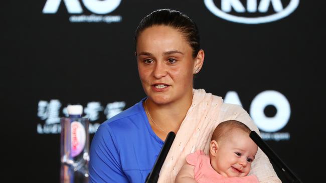 Ashleigh Barty speaks to the media holding her niece Olivia. Picture: Getty