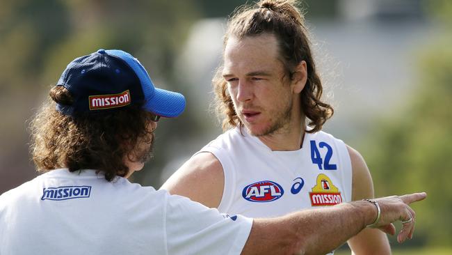 Western Bulldog Liam Picken talks with club doctor Gary Zimmerman. Pic: Michael Klein