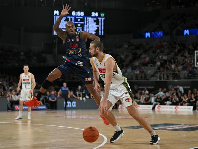 MELBOURNE, AUSTRALIA - NOVEMBER 26: Jack Mcveigh of the Jack Jumpers drives the ball as Xavier Rathan-Mayes of Melbourne United attempts to defend during the round 8 NBL match between Melbourne United and Tasmania Jackjumpers at John Cain Arena, on November 26, 2022, in Melbourne, Australia. (Photo by Morgan Hancock/Getty Images)