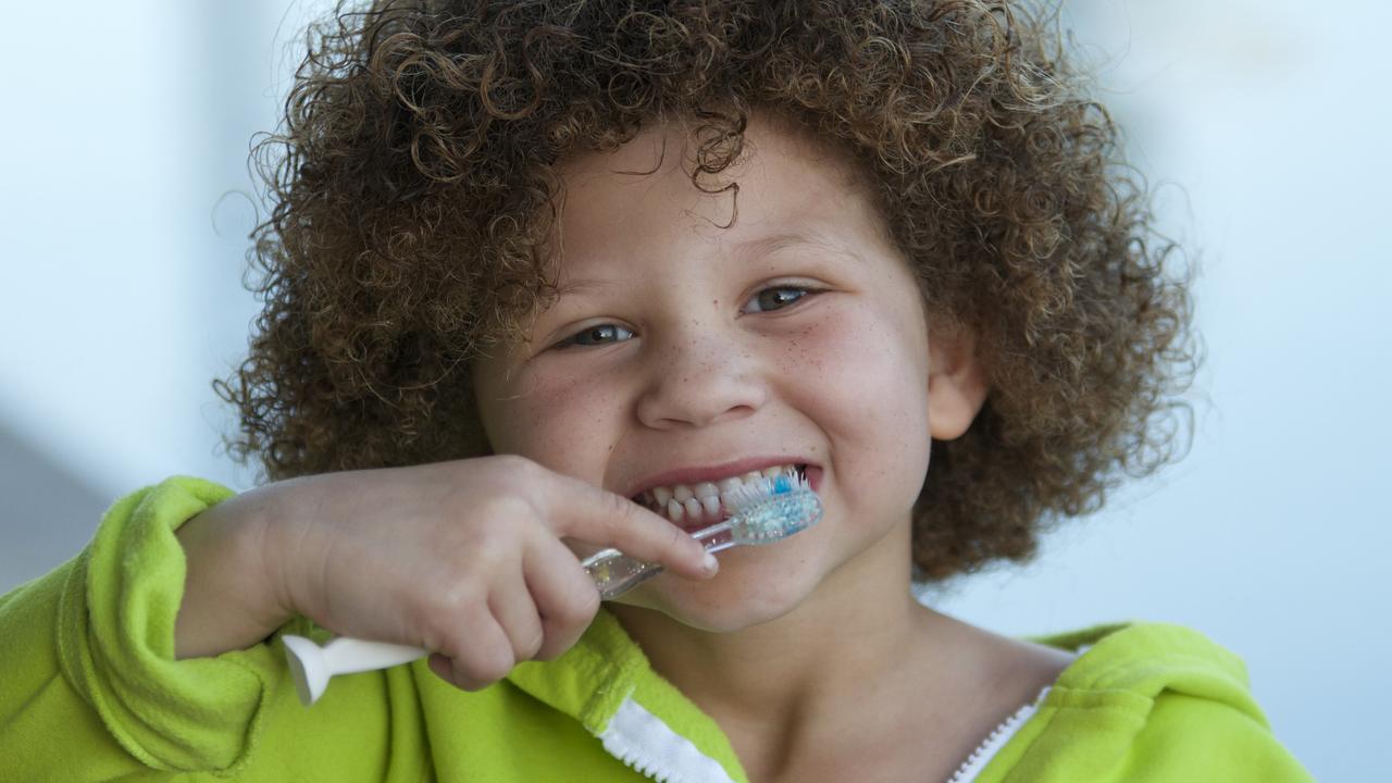 Brushing with fluoride toothpaste, eating well and using mouthguards can all protect your teeth as you grow. Picture: iStock