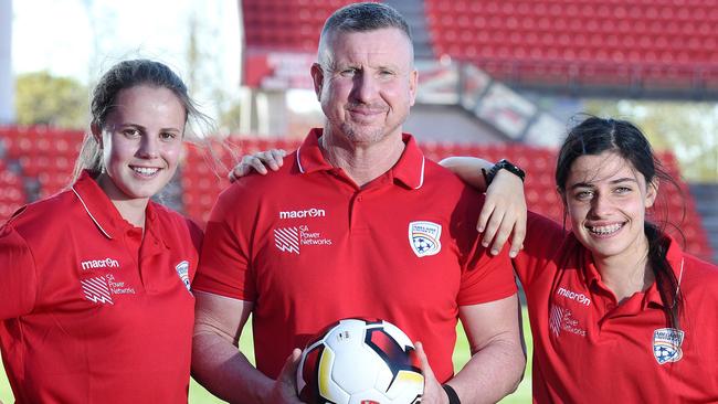 Adelaide United women’s team coach Mark Jones with new signings Emily Condon and Alex Chidiac. Picture: Roger Wyman
