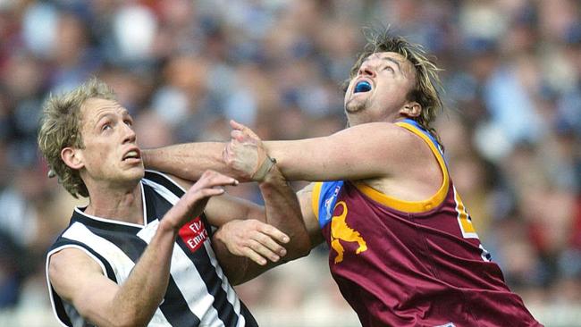 Clark Keating battles with Collingwood’s Josh Fraser during the 2003 AFL grand final.