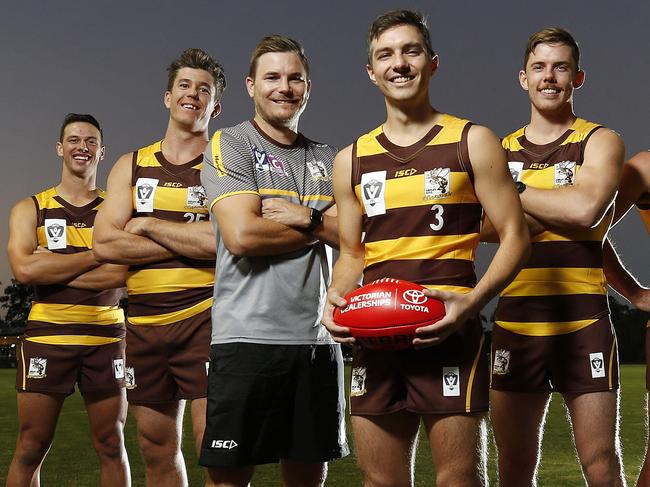 Ryan Bastinac, Jordon Arnold, James Nelis, Daniel Webster (coach), James Ives (captain), Jordan Hayden, Corey Lyons, Will Gowers, and Jasper Craven from the Aspley Hornets pictured at Aspley, Brisbane 13th of April 2021.  The Aspley Hornets will be joining the VFL.  (Image/Josh Woning)