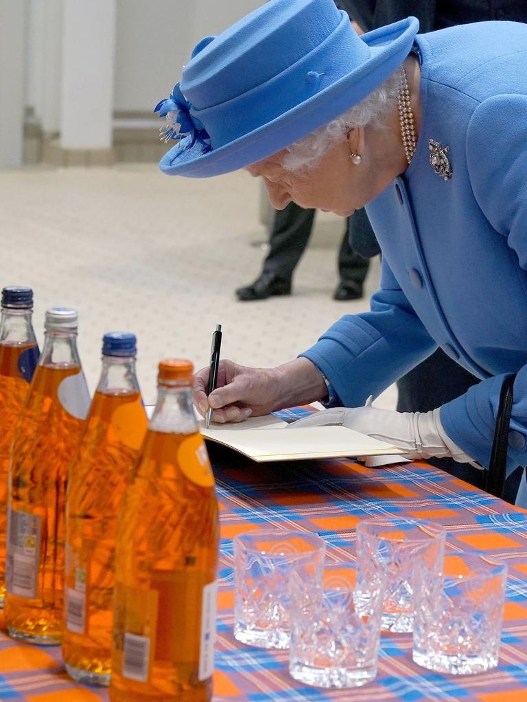 Queen Elizabeth II walks through the factory floor during a visit the AG Barr's factory. Picture: Getty