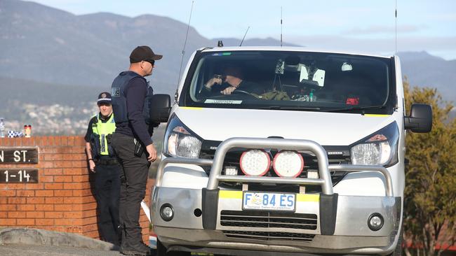 The coroners ambulance leaves the scene. Tasmania Police investigating a body found in Carbeen Street Mornington. Picture: NIKKI DAVIS-JONES