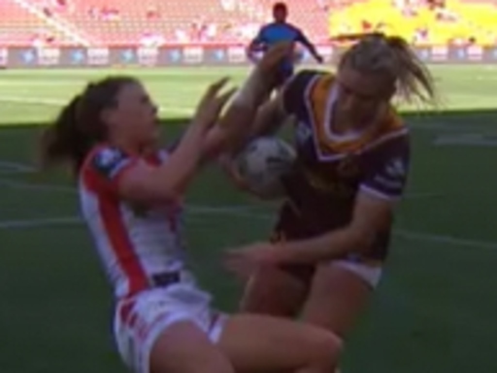 Julia Robinson of the Broncos (right) is tackled by Ruan Sims of the  Roosters during the