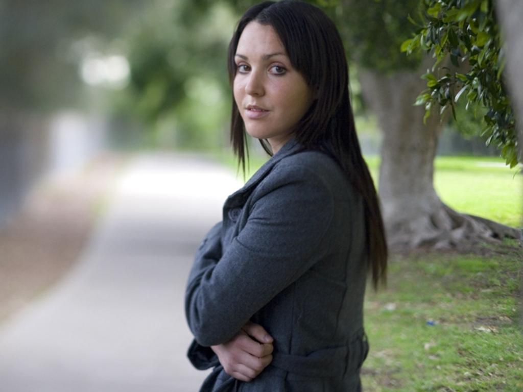 Nina Funnell pictured at age 23 at the spot where her sexual assault took place.