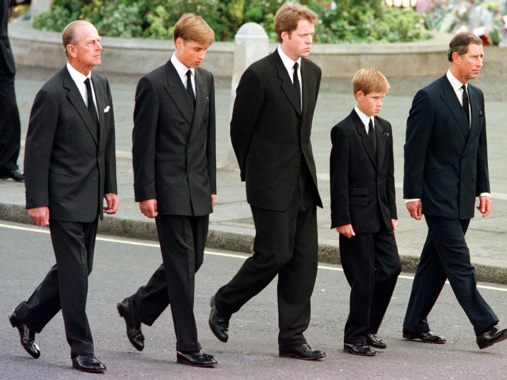 September 6, 1997 (L to R) Britian's Prince Philip, Duke of Edinburgh, Prince William, Earl Spencer, Prince Harry and Prince Charles, Prince of Wales, walk outside Westminster Abbey during the funeral service for Diana, Princess of Wales. Picture: JEFF J MITCHELL / POOL / AFP