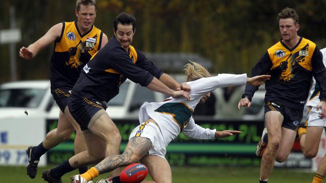 Whittlesea’s Nathan Stefanile pushes Aaron Shaw off the ball. Picture: Richard Serong.