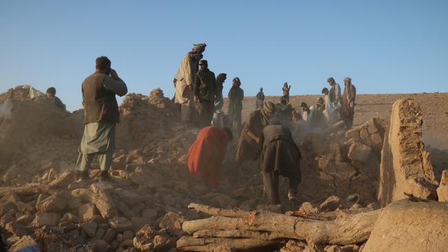 Afghan residents clear debris from a damaged house after an earthquake hit Sarboland village in the Zinda Jan district of Herat province. Picture: AFP