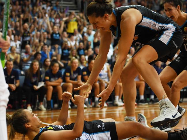 Leilani Mitchell of the Canberra Capitals (bottom) scores during game three of the WNBL Grand Final against Adelaide Lightning at AIS Arena. Picture: Getty Images