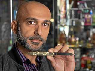 Owner of TSG Tobacco at Booval Fair Hitesh Khatri was mistakenly selling a knife with Nazi symbols. Picture: Cordell Richardson