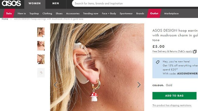 Natasha Ghouri models the earrings on the ASOS website.