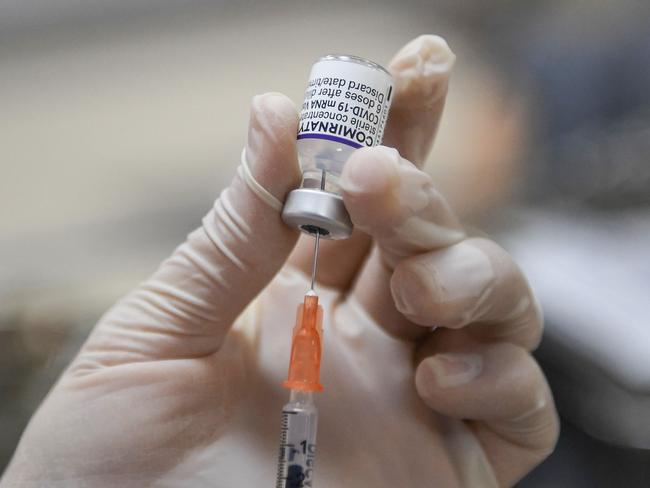 A medical staff member prepares a dose of the Pfizer/BioNTech Covid-19 coronavirus vaccine. Picture: AFP