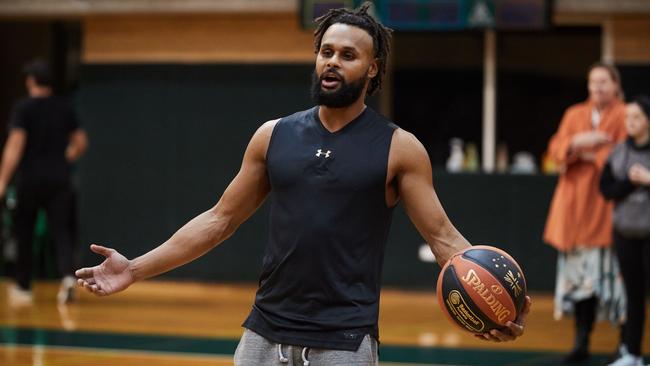 WARNING - UNDER EMBARGO UNTIL SUNDAY 8TH JULY - DO NOT USE WITHOUT SPEAKING TO ST PIC ED JEFF DARMANIN. Australian NBA star, Patty Mills, pictured in Sydney today during a basketball clinic for kids at Trinity Grammar School. Picture: David Swift.