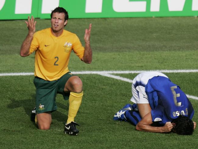Lucas Neill reacts after the tackle on Italian Fabio Grosso. Pic: AFP