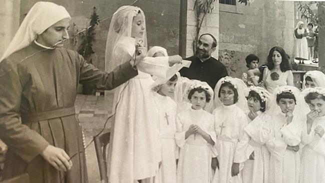 Carole Haddad, aged 8, giving a speech at the convent in Lebanon where she was raised by nuns until age 15. Photo: Supplied.