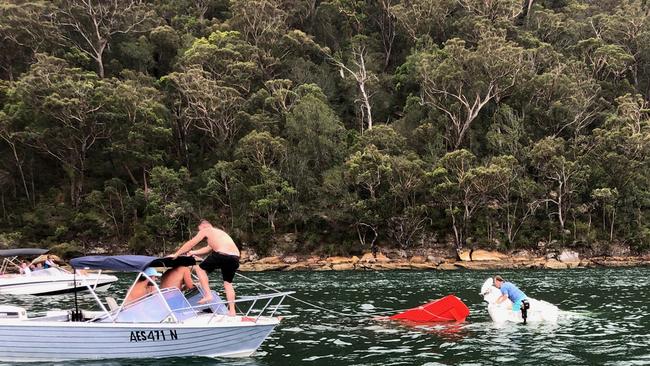 The attempted rescue effort carried out by Lachlan Hewitt, Kurt Bradbury and Will McGovern and Todd Sellars. The four men attempted to stop the Sydney Seaplane piloted by Gareth Morgan, 44, from sinking after the plane ploughed into water, killing catering tycoon Richard Cousins, his fiancee Emma Bowden, her daughter Heather, 11, and Mr Cousins’ sons William, 25, and Edward, 23. MUST CREDIT: Todd Sellars