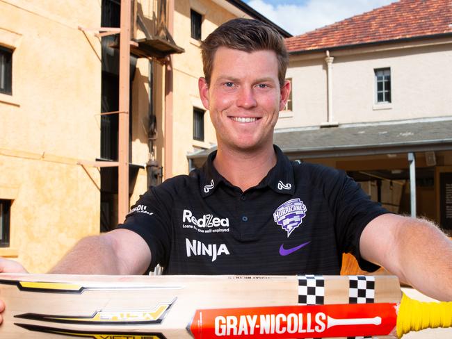 Hobart Hurricanes Mitch Owen at TMAG with the championship-winning bat which will be donated to the museum.Picture: Linda Higginson