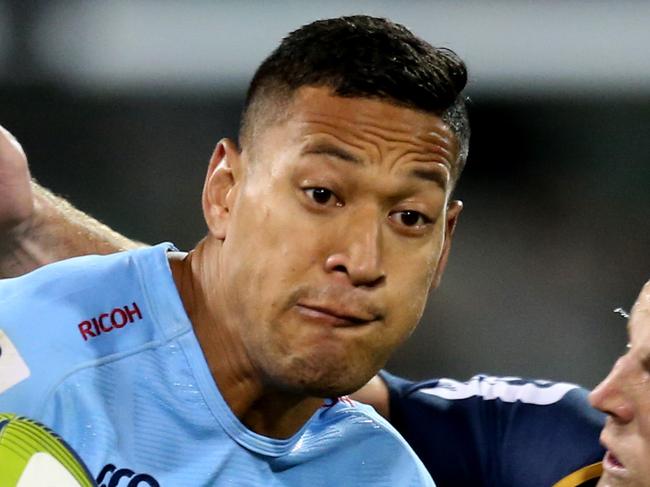 Brumbies vs Waratahs at GIO Stadium in Canberra. Brumbies Stephen Moore tackles Waratahs Israel Folau. Pic By Kym Smith