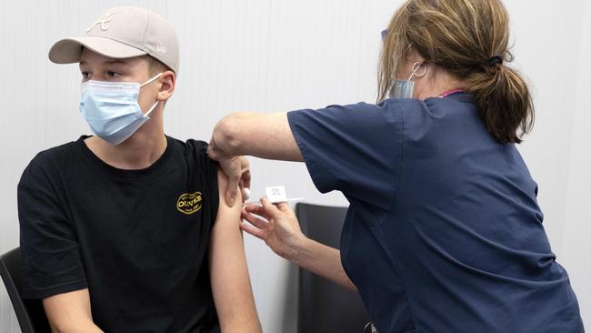 Arley Kluck, 14, gets his second Pfizer vaccination at the Ipswich vaccination hub. Picture: NCA NewsWire / Sarah Marshall