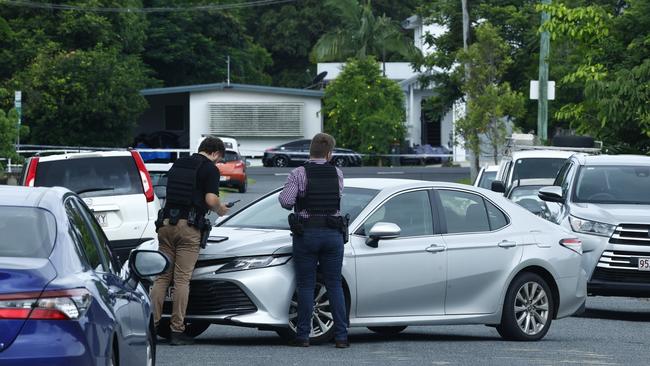 Police officers respond to reports of a shooting on Collins Ave, Edge Hill, by setting up a 500 metre exclusion zone. Edge Hill State School, a nearby kindergarten and swim school placed into lockdown. A black Audi TT coupe involved in the initial incident was later found abandoned outside a Pease Street address. Picture: Brendan Radke