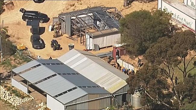 Police search a property linked to the Hells Angels Bikie club at Ponde, South Australia today. Picture: 7 News Adelaide