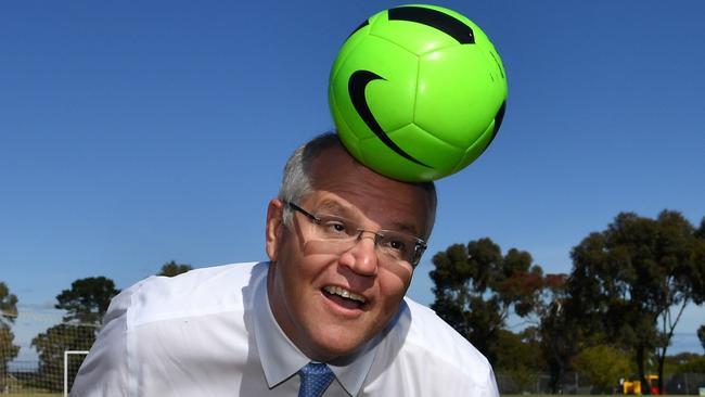 Prime Minister Scott Morrison heads a soccer ball at Manson Park in Adelaide. Picture: AAP