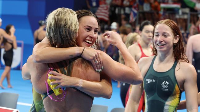 Ariarne Titmus, Brianna Throssell and Mollie O'Callaghan of Team Australia celebrate after winning gold in the Women's 4x200m Freestyle Relay. Photo by Xavier Laine/Getty Images.