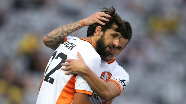 Jamie Maclaren, right, and Thomas Broich celebrate Roar’s winning goal against Central Coast Mariners last Sunday.