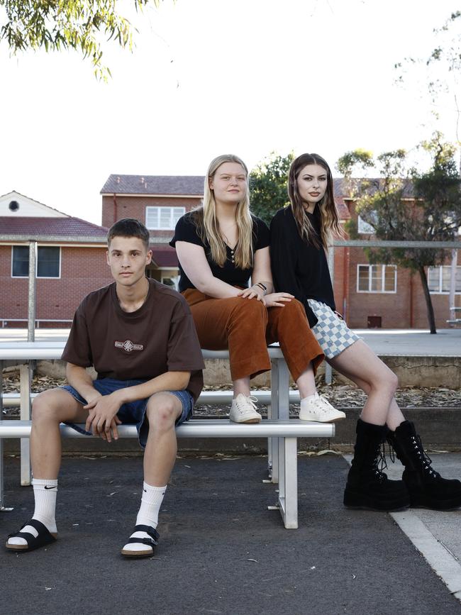 HSC students Riley Merton, Grace Molloy and Alani Woods had to study at school the night before a HSC exam because there was no power at home. Picture: Richard Dobson