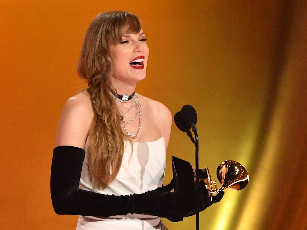 TOPSHOT - US singer-songwriter Taylor Swift accepts the Best Pop Vocal Album award for 