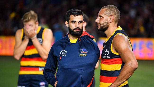 Wayne Milera is comforted by Crows teammate Cam Ellis-Yolmen after injuring his left shoulder against Gold Coast last week. Picture: DANIEL KALISZ (Getty Images).