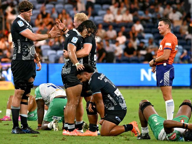 Players from the Waratahs and Drum react after the end of their Super Rugby match. Picture: SAEED KHAN / AFP