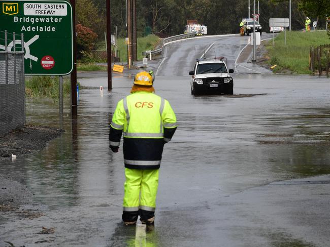 A CFS vehicle drives through floodwaters on Mt Barker Rd at Verdun. Picture: Campbell Brodie.