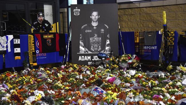 Floral tributes are placed for Nottingham Panthers player Adam Johnson, who died from a skate cut to the neck. AP Photo/Rui Vieira, File.