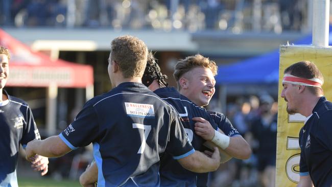 SCU Marlins players celebrate after a Jarryd Frank try on Saturday.