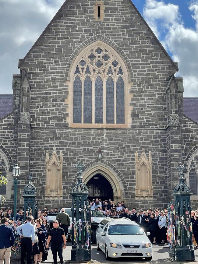 The hearse leaves teacher James Petrie's funeral at St Patrick's Cathedral in Ballarat.