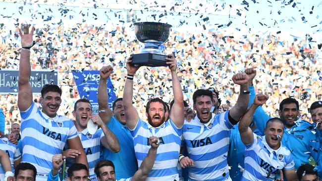 Julian Montoya of Argentina lifts the trophy with teammates after winning a historic during a Rugby Championship match over the Wallabies. Picture: Getty Images.