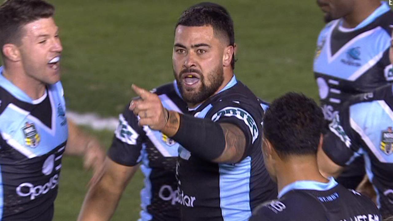 Andrew Fifita directs a spray at the Cronulla coaches box.