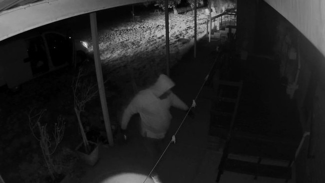 A fourth man is seen leaving the van and entering the property before the group flee. Picture: Victoria Police