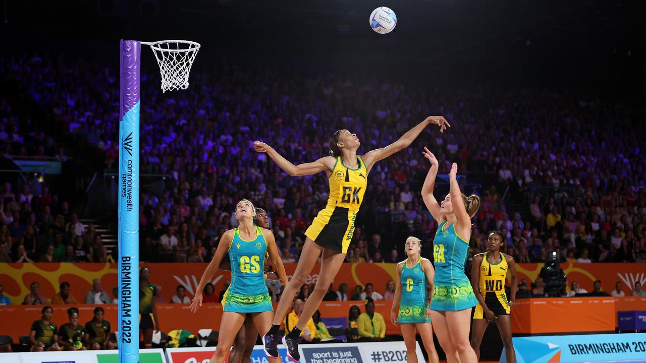 Steph Wood of Team Australia shoots as Shamera Sterling of Team Jamaica attempts to block