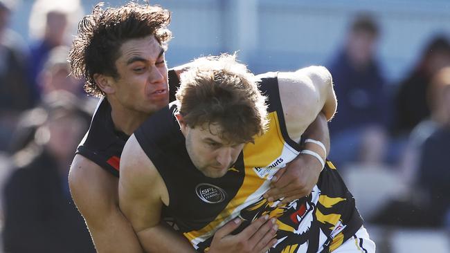 Taine Sookee, of Lauderdale, pictured tackling Tiger Tyler Carter, will miss the next two matches through injury. Picture: Nikki Davis-Jones