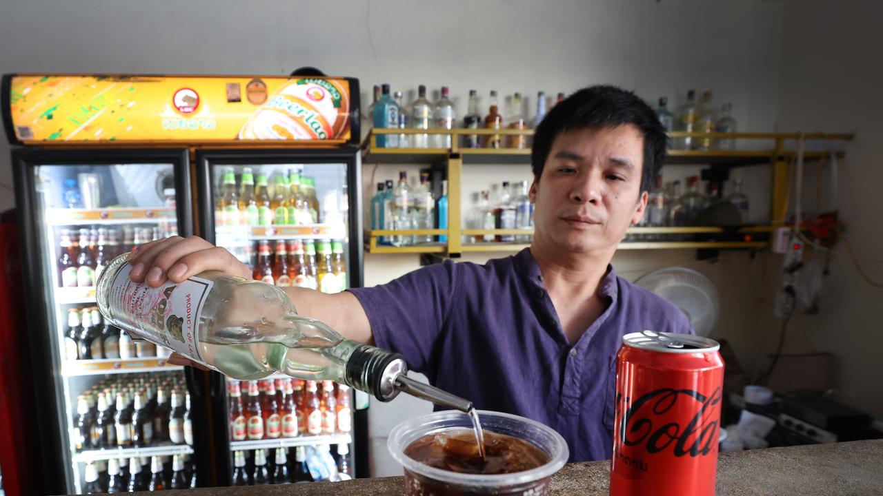 Nana Backpackers Hostel bar tender Toan Van Vanng pours in the same Vodka and Coke drink the girls had and drinks it.