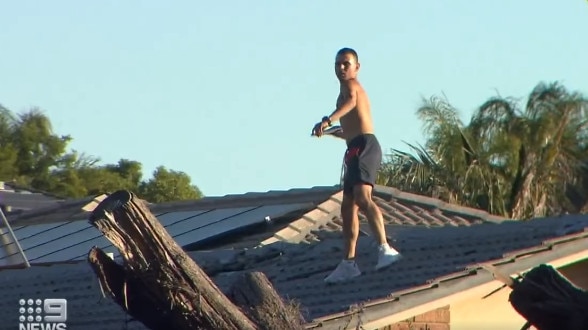 Tyson Wilson, 20, has been charged with damaging police cars and assaulting a police officer by throwing roof tiles at them at Reynella East. Picture: Nine News