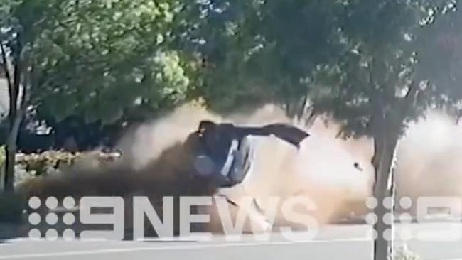 A camera has captured the heart-stopping moment a car flipped and crashed on a residential street. Picture: 9 News