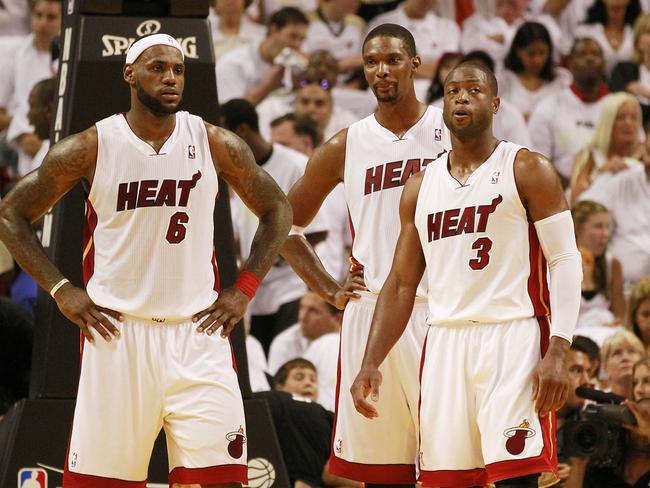 LeBron (left) was offered NFL contracts while he was at the Miami Heat. (Photo by Marc Serota/Getty Images)