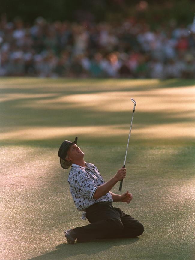 Greg Norman collapses on the ground after narrowly missing his chip shot in the 1996 US Masters. Picture: Stephen Munday