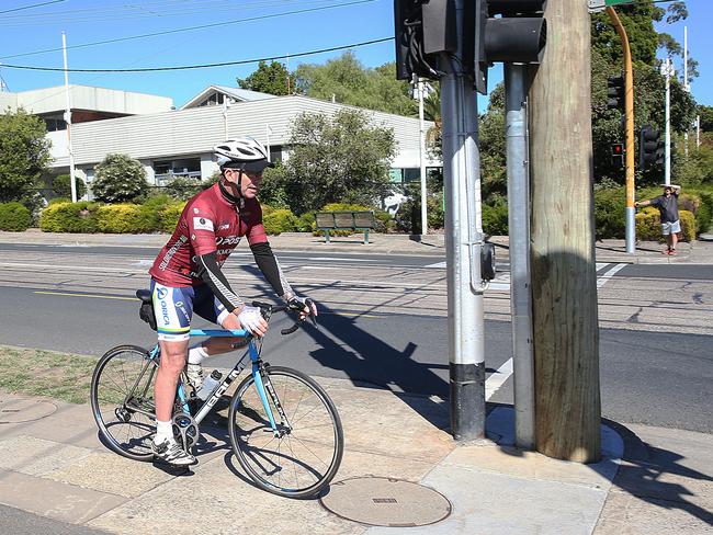 Liberal MP Tony Abbott cycling in Kew, Victoria on Saturday. Picture: Ian Currie